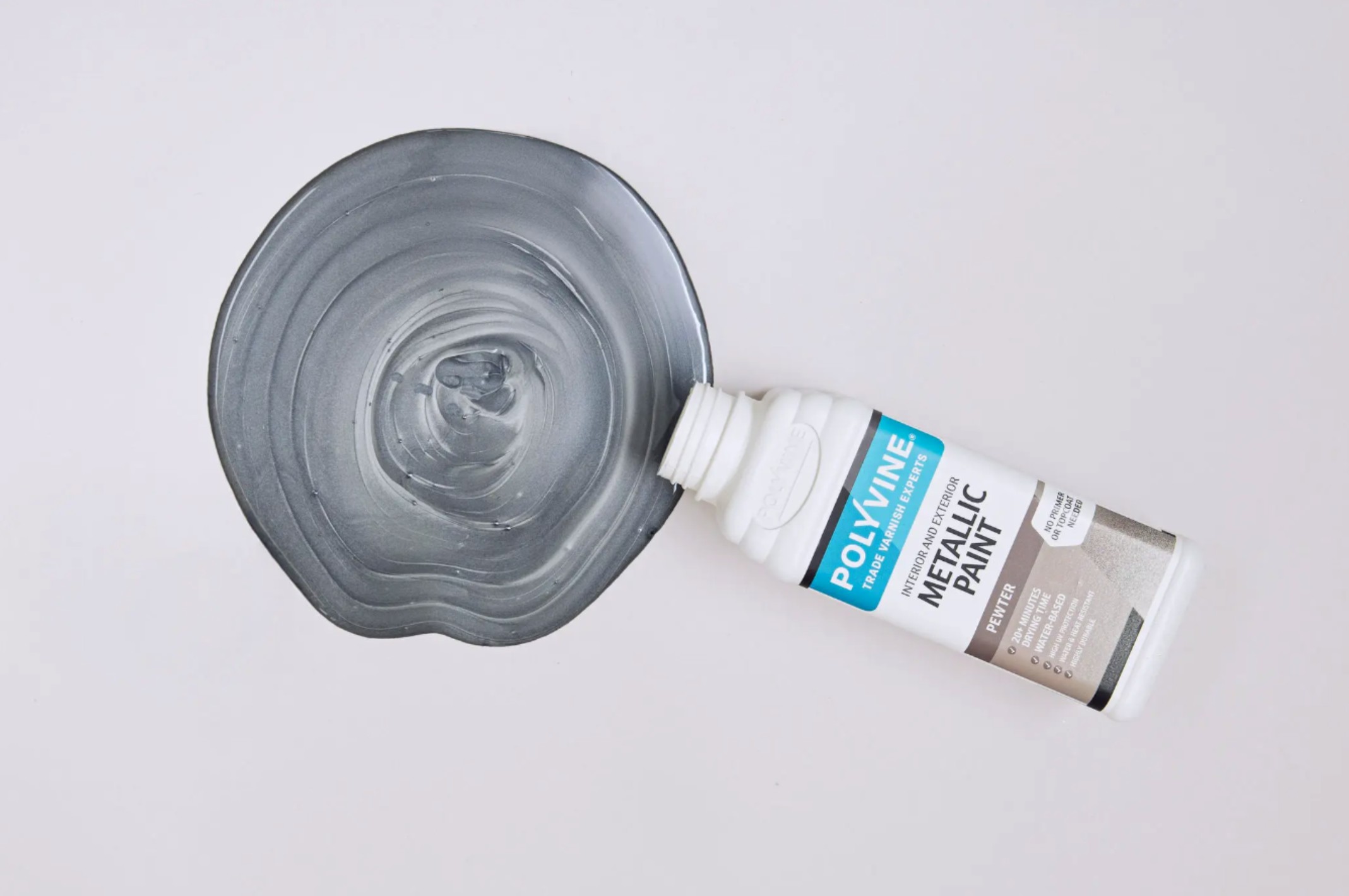 A spilled tub of Polyvine Metallic Pewter Paint