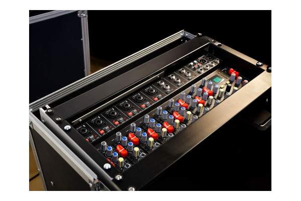 An Image of the mixer in a flight case within a venue