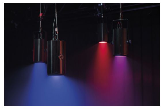 An Image of the Showtec performer house lights projecting coloured light into a venue