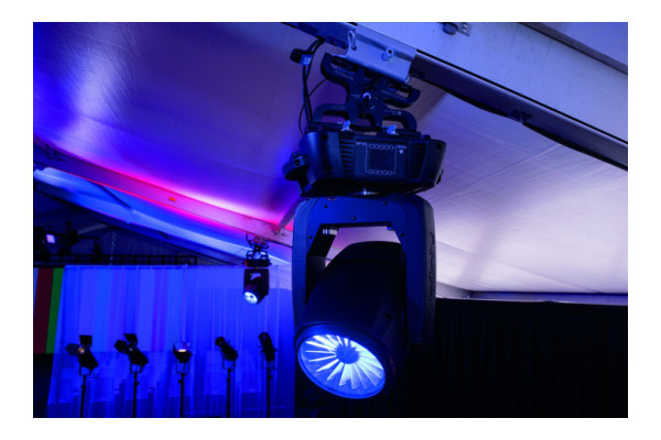 An Image of the Showgear Leveling clamp attached to both a lighting fixture and tent clamp