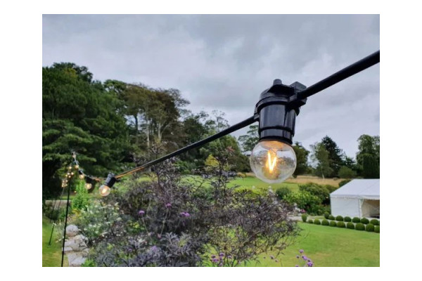 An Image of the lamps being used with the festoons at an event