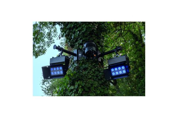 An Image of some light fixtures being supported by the showgear tree poles from a tree