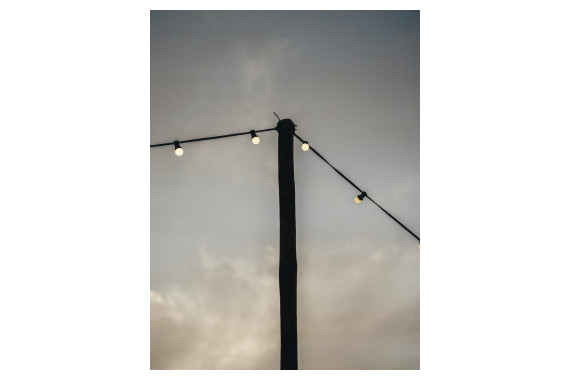 A string of the PCE festoons being used connected to a telegraph pole